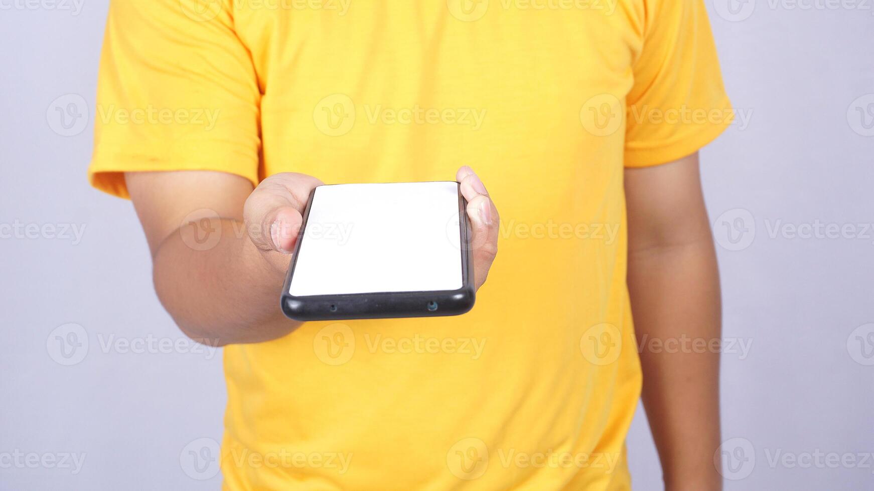 Man hand giving mobile phone mock up blank screen isolated on white background photo
