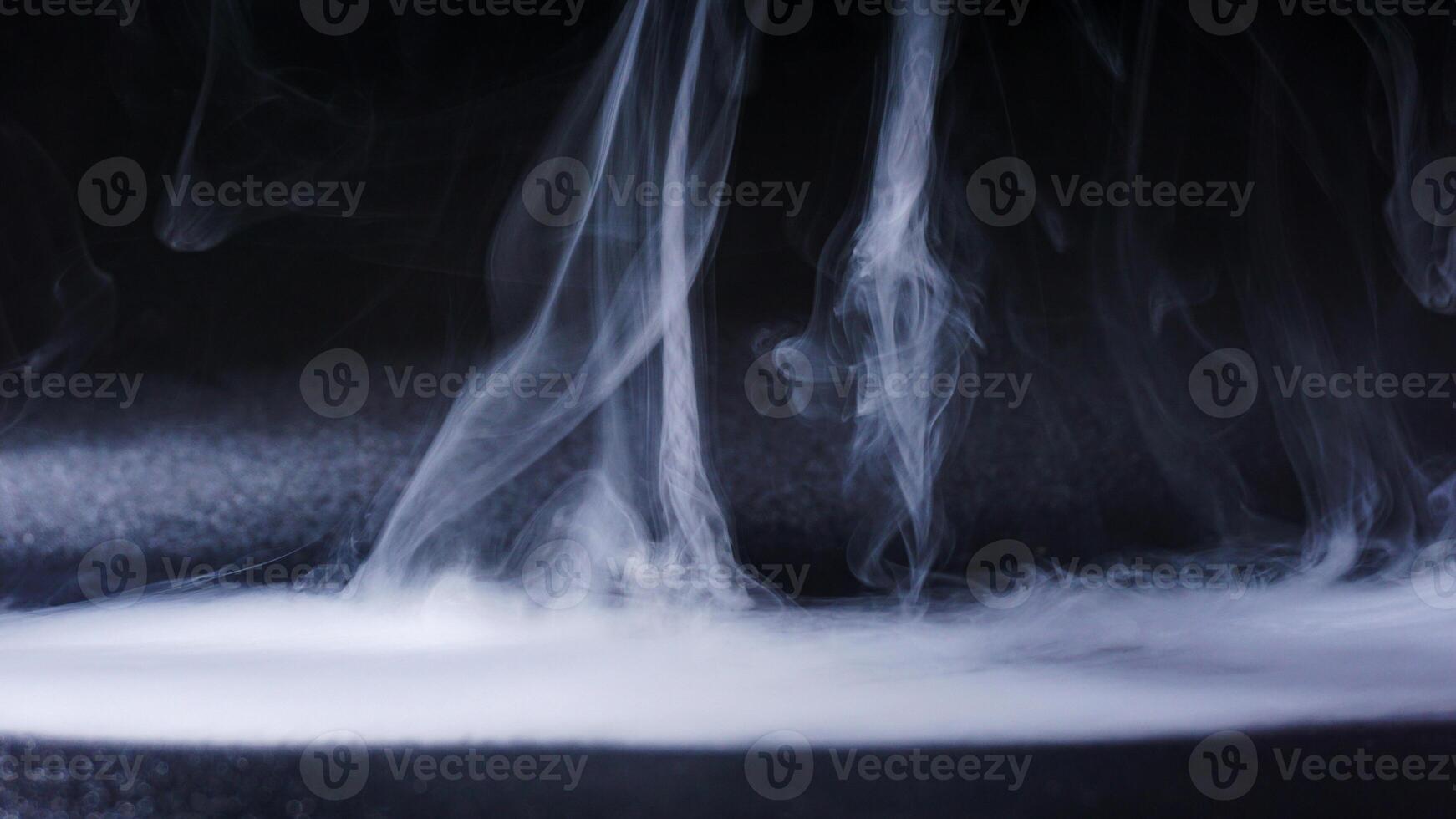 Dense fog isolated on black background photo