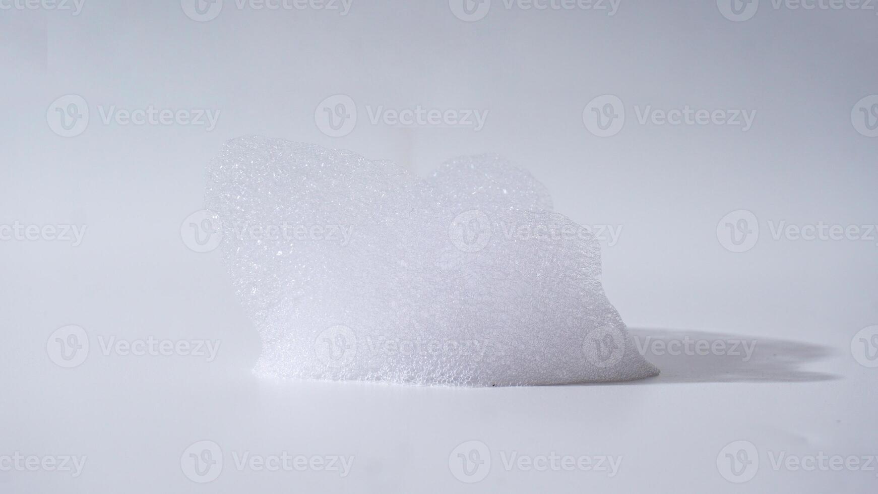 Soap foam isolated on white background photo
