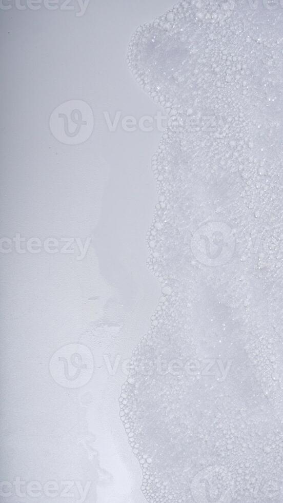 Soap foam or shampoo foam or detergent foam with bubbles isolated on white background photo
