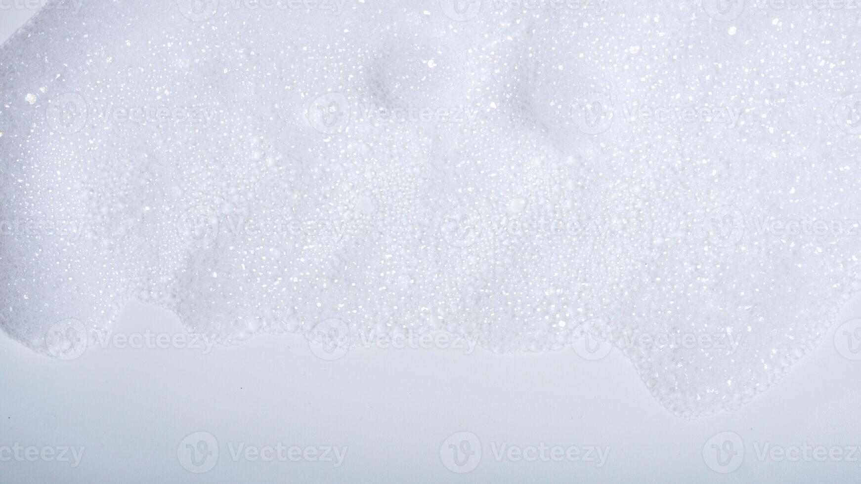 Foam with bubbles isolated on white background photo