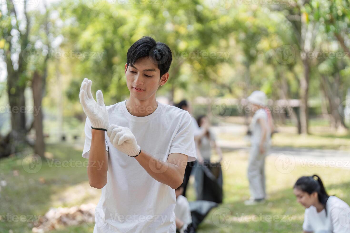 Young volunteer preparing for a park cleanup, highlighting commitment to environmental conservation and community service. photo
