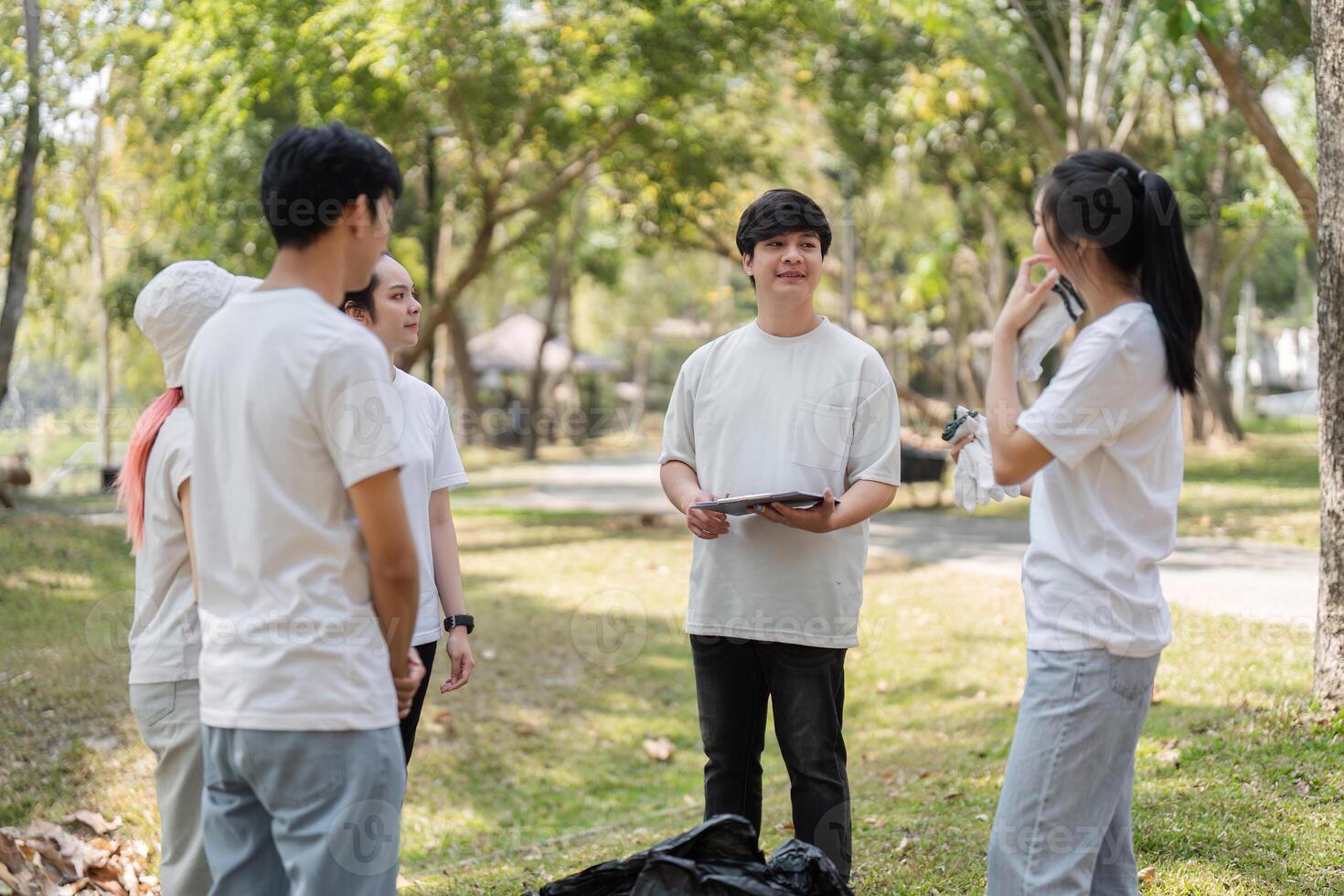 Leadership and Planning. Volunteer leader discussing tasks with the group. photo