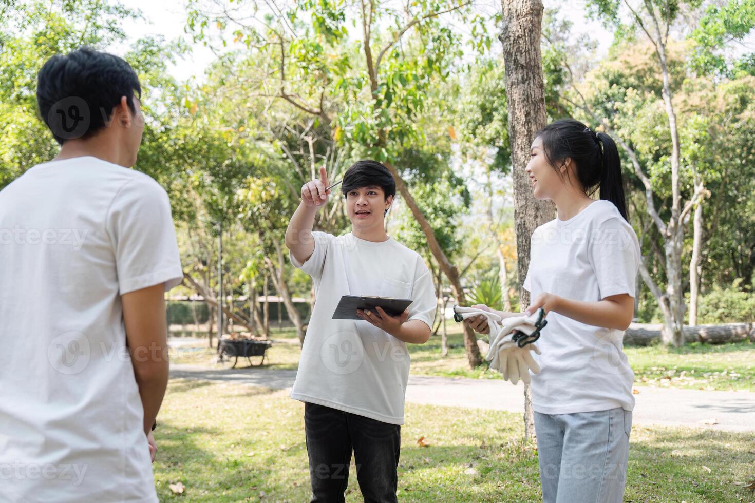 Leadership in action. Young volunteers planning a community clean-up event. photo