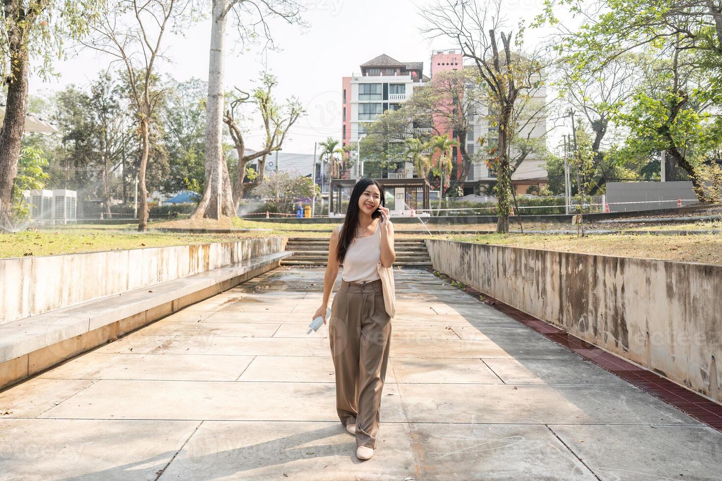 Sustainable lifestyle. Woman enjoying a moment while walking with reusable items in hand. photo