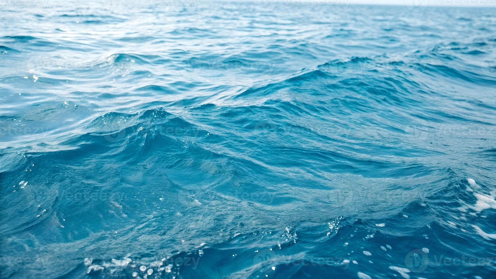 Calm ocean waves gently rippling under sunlight for serene nature backgrounds, perfect for travel and relaxation content creators photo
