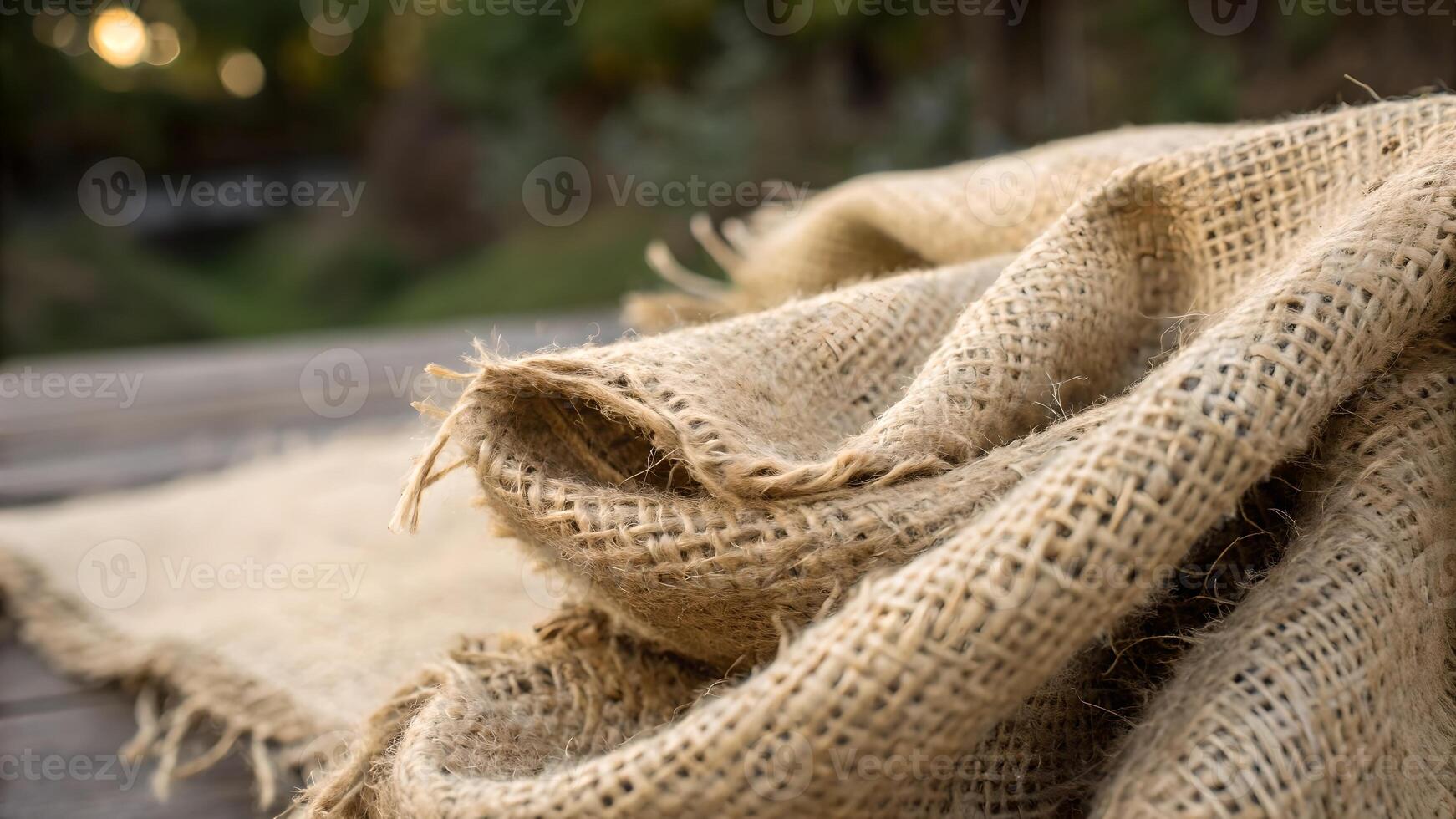 Cozy Knitted Blanket Softly Draped on Wooden Table for Home Decor Enthusiasts Seeking Warmth and Comfort in Their Living Spaces photo