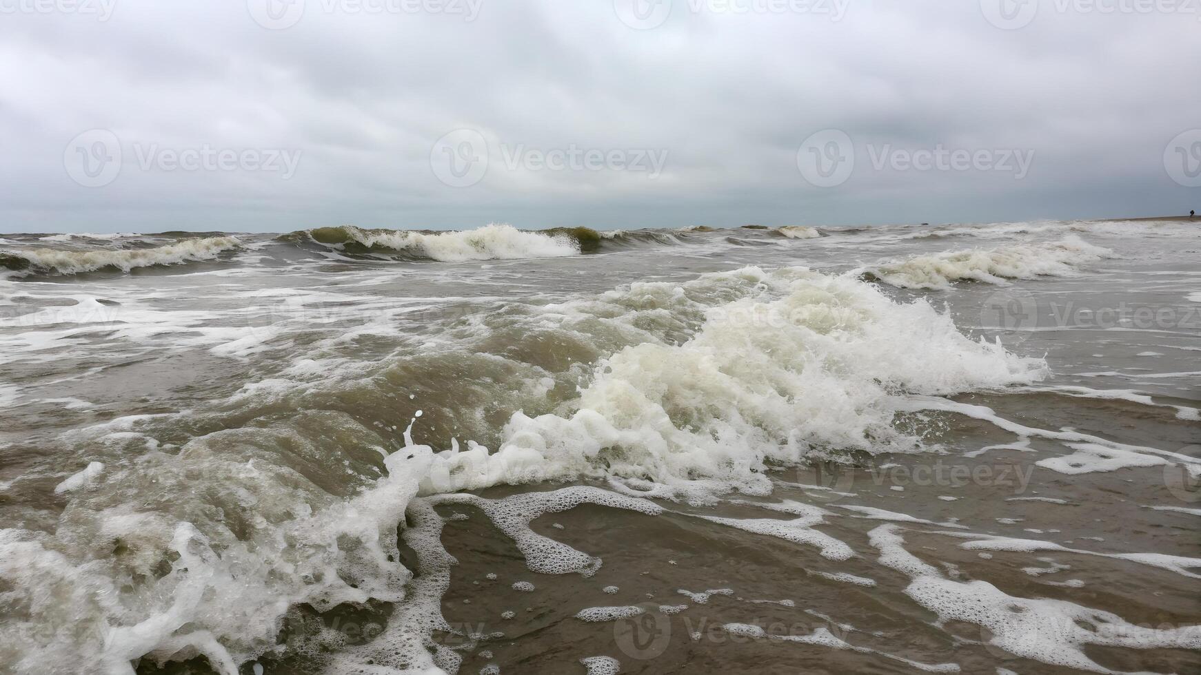 Ocean waves crashing powerfully on sandy beach for nature enthusiasts and photographers photo