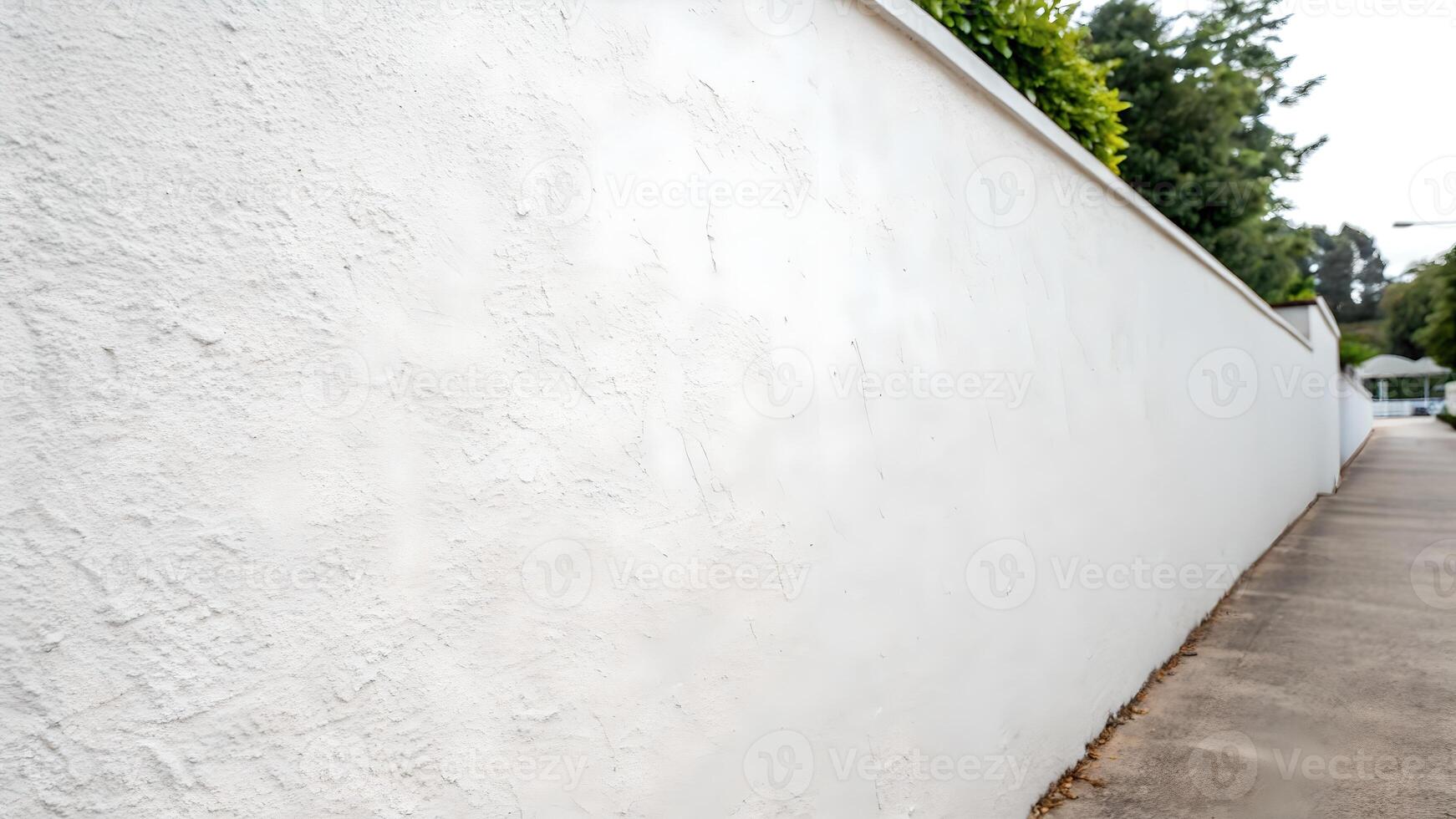 White wall texture in outdoor setting for design professionals and DIY enthusiasts. Perfect for backgrounds, textures, and creative projects. Ideal for websites, presentations, and print materials. photo