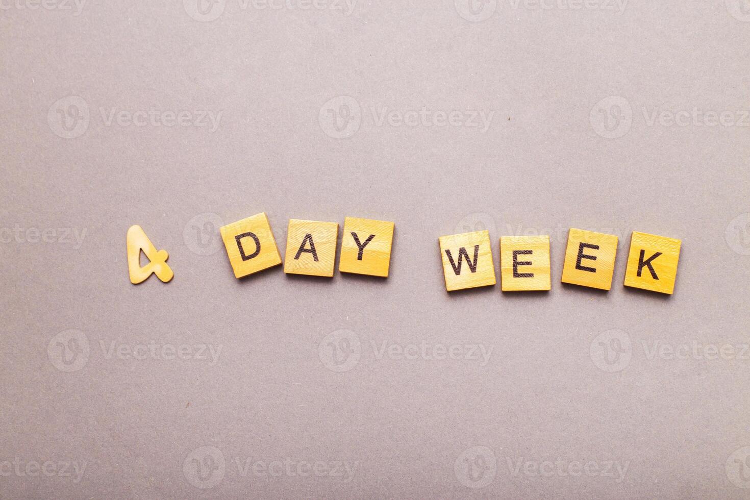 inscription four day week making by wooden cubes photo