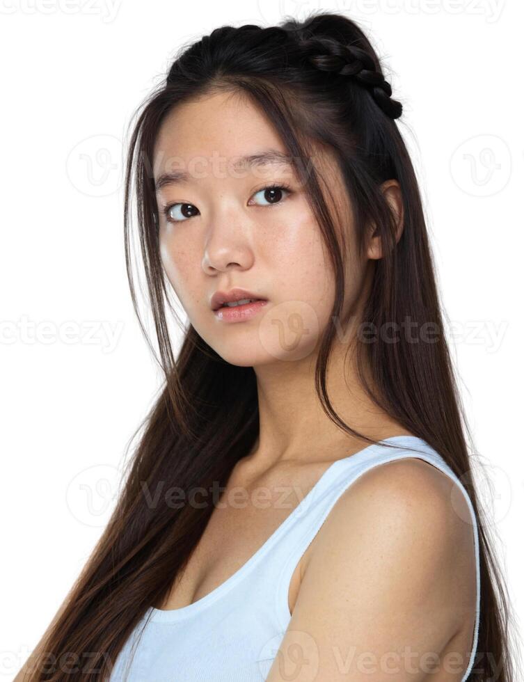 A young woman with long hair and a tank top photo