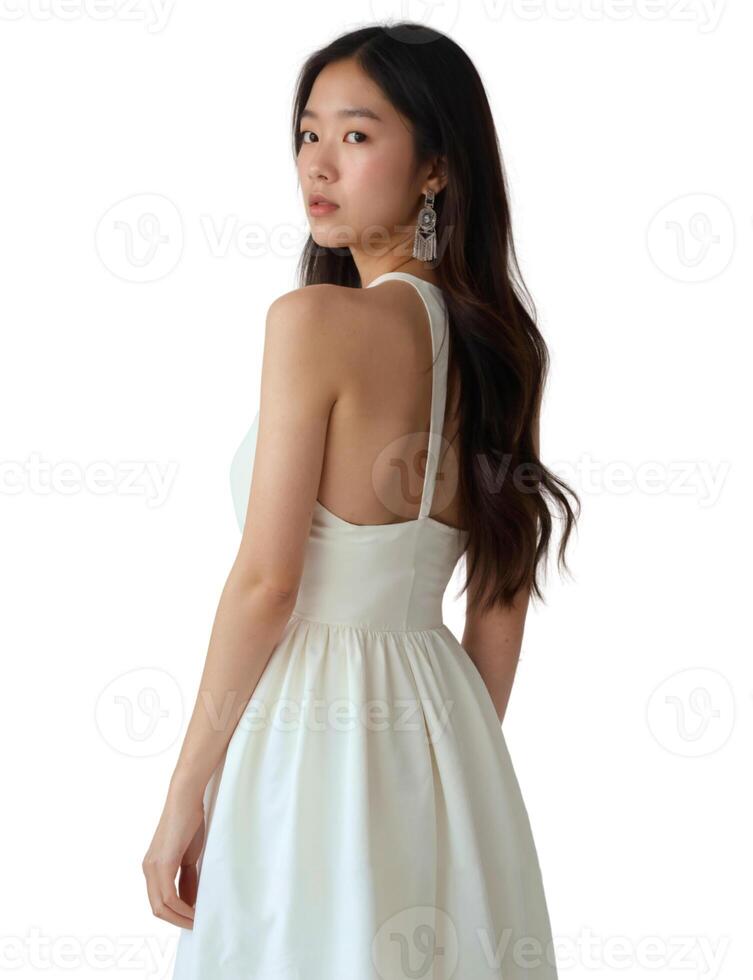 The back view of a woman wearing a white dress photo