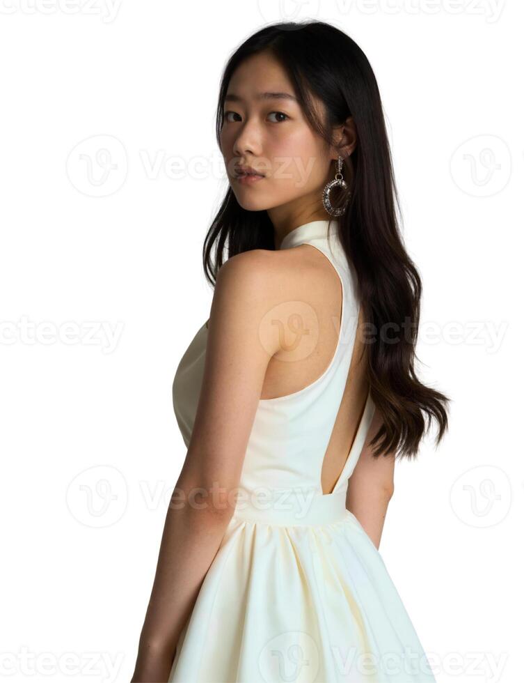 The back view of a young woman wearing a white dress photo