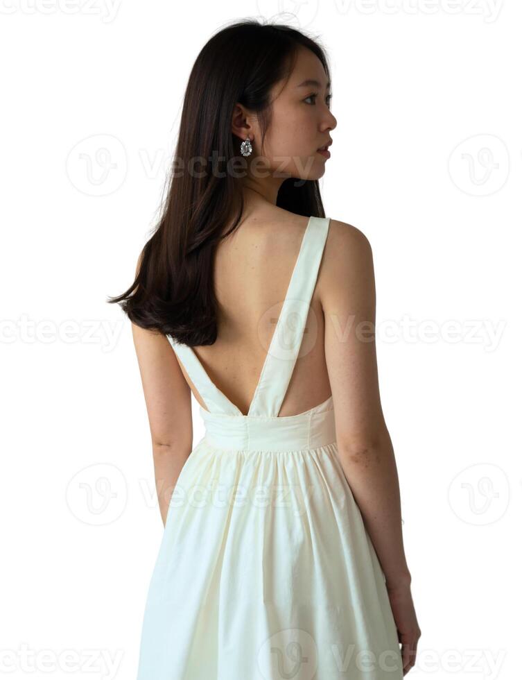 The back view of a woman wearing a white dress photo
