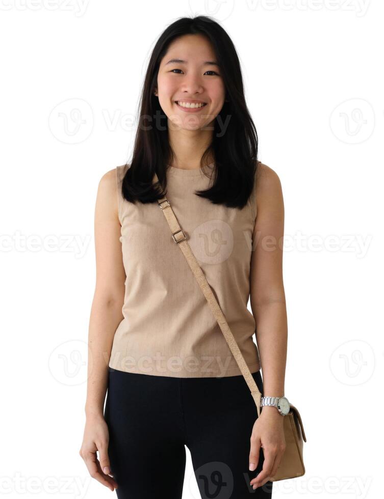 A woman in a tan top and black pants photo