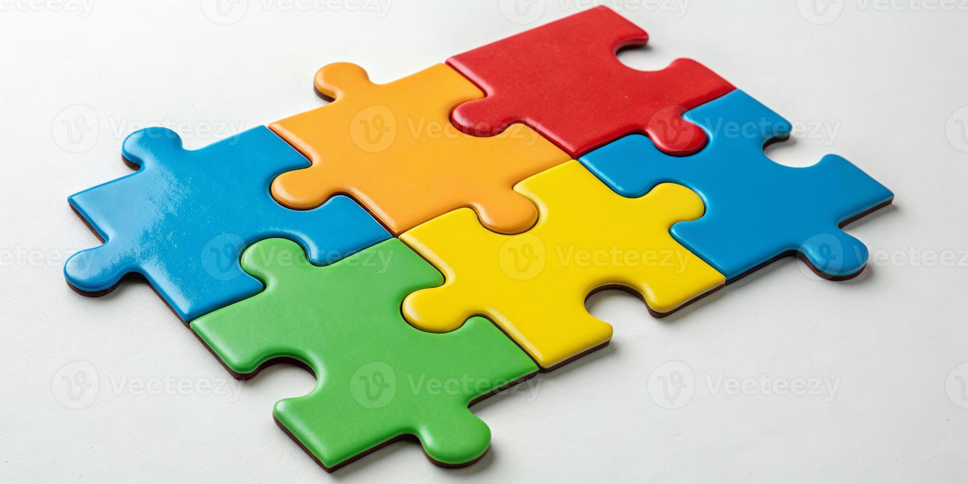 Four colorful puzzle pieces arranged on a flat surface top down view educational concept creative environment photo
