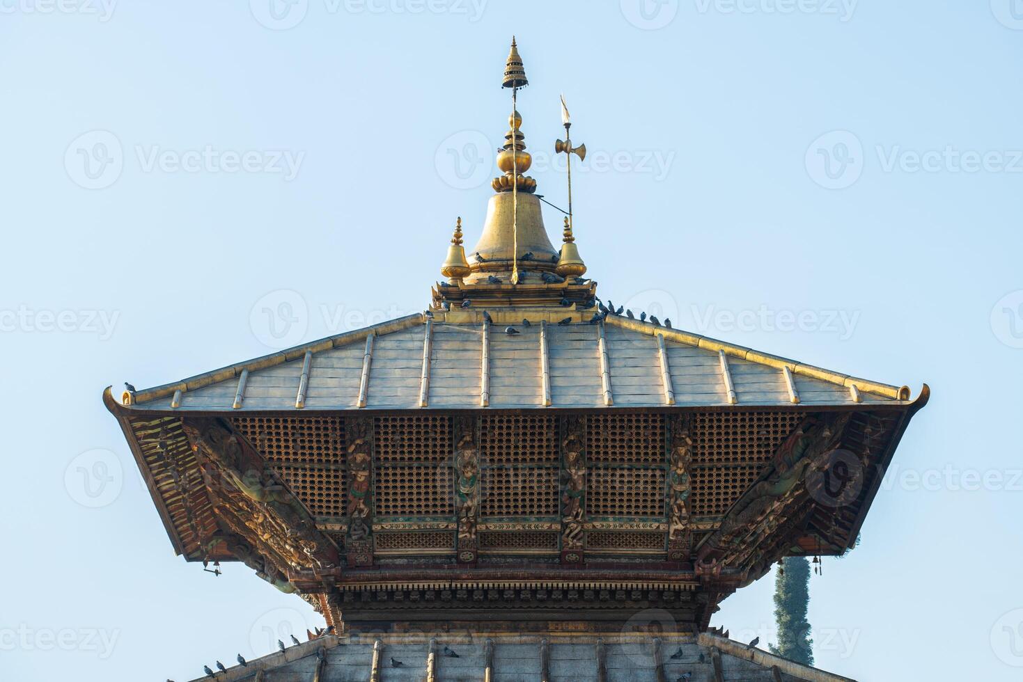 A bunk roof and a golden spire on main temple of Pashupatinath in Kathmandu, Nepal. photo
