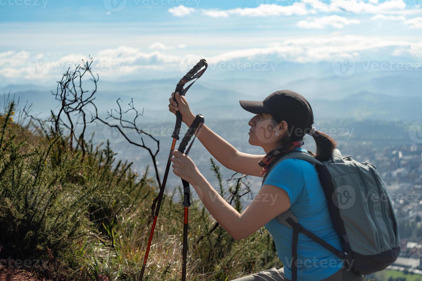 A hiker climbs the Naranco mountain in the city of Oviedo, Spain, while an impressive landscape can be seen in the background. photo