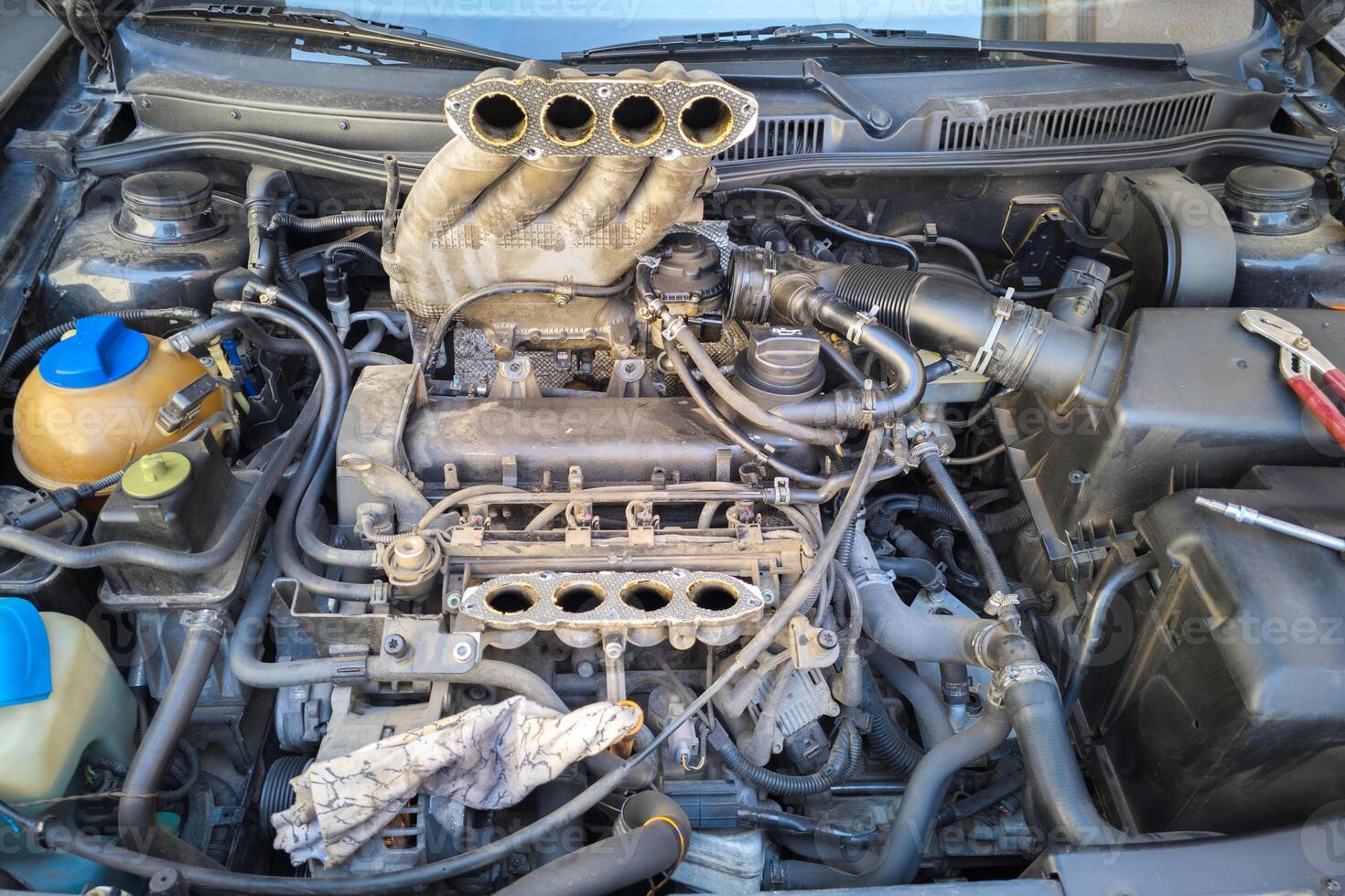 old inline 4 cylinder combustion gasoline engine with dismounted air intake photo