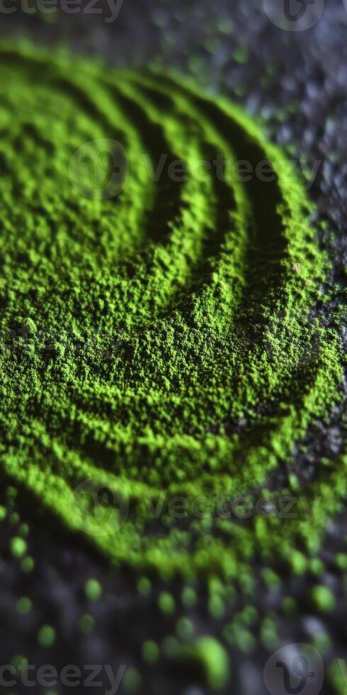 Moringa powder spread in creative swirls on a dark surface photo