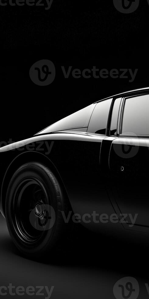Classic black sports car captured in dramatic lighting photo