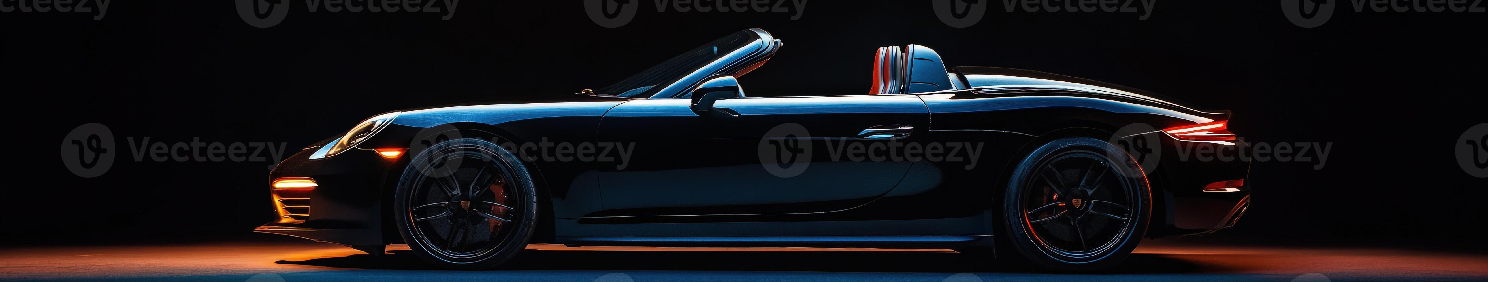 Sleek black convertible car showcased against a dark background photo