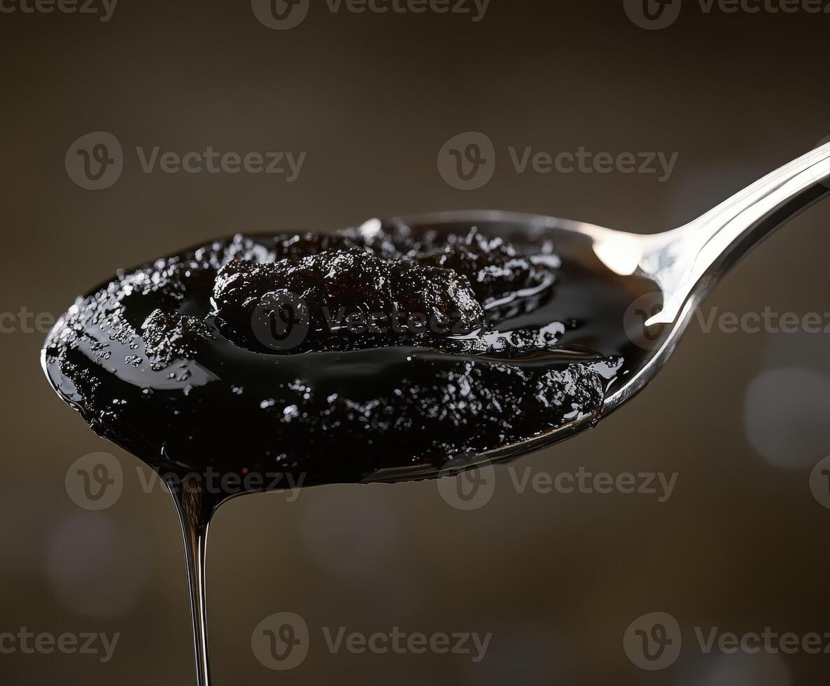 A spoon with a liquid on it photo
