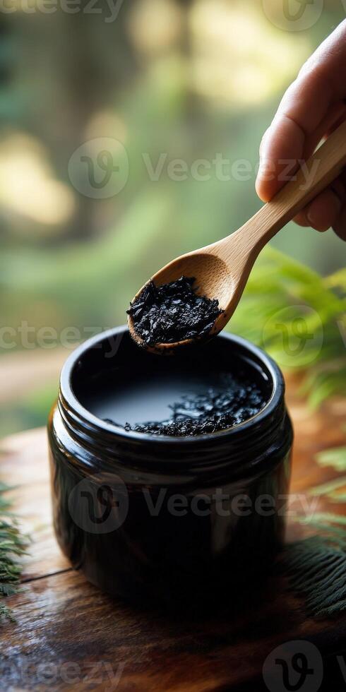 Black charcoal facial scrub photo
