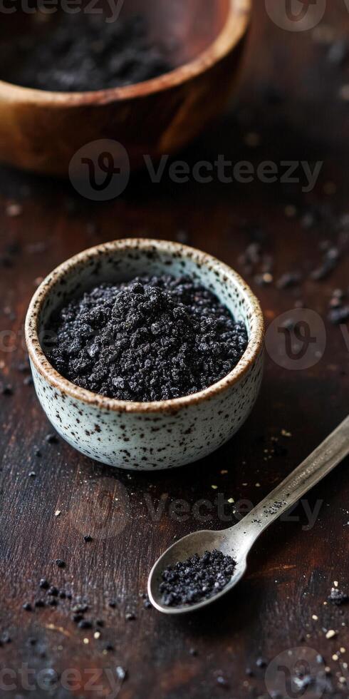 Natural shilajit resin in a decorative bowl with a spoon photo