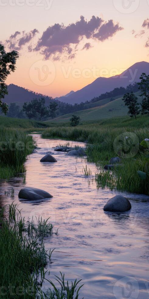 Tranquil river at sunset with mountains and boulders in view photo