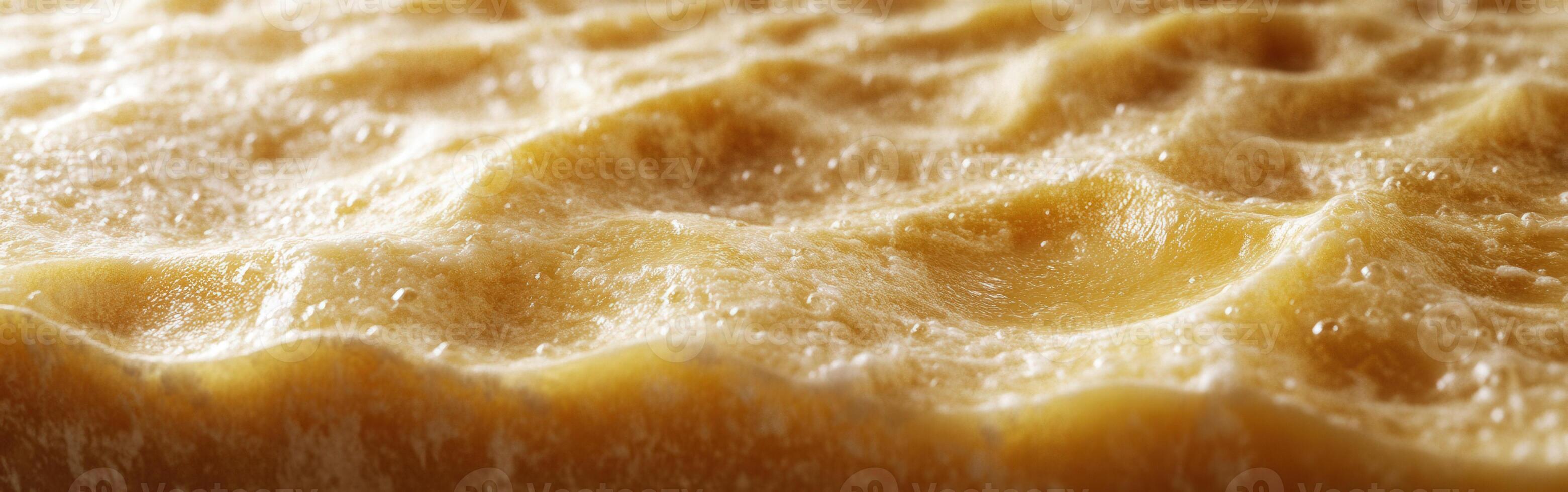 Detailed close-up of parmesan cheese showcasing its texture and surface characteristics in a well-lit environment photo