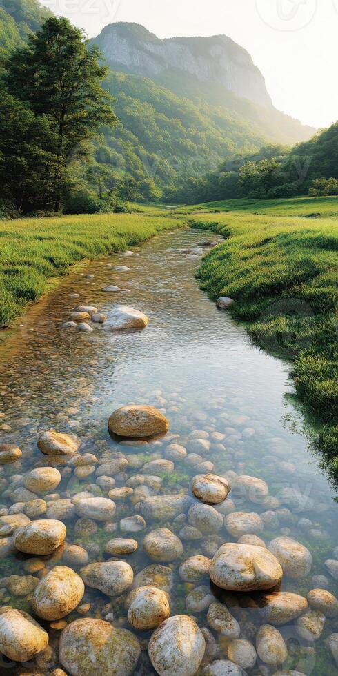 Peaceful mountain river meanders through lush green landscape during golden hour in nature's serene beauty photo