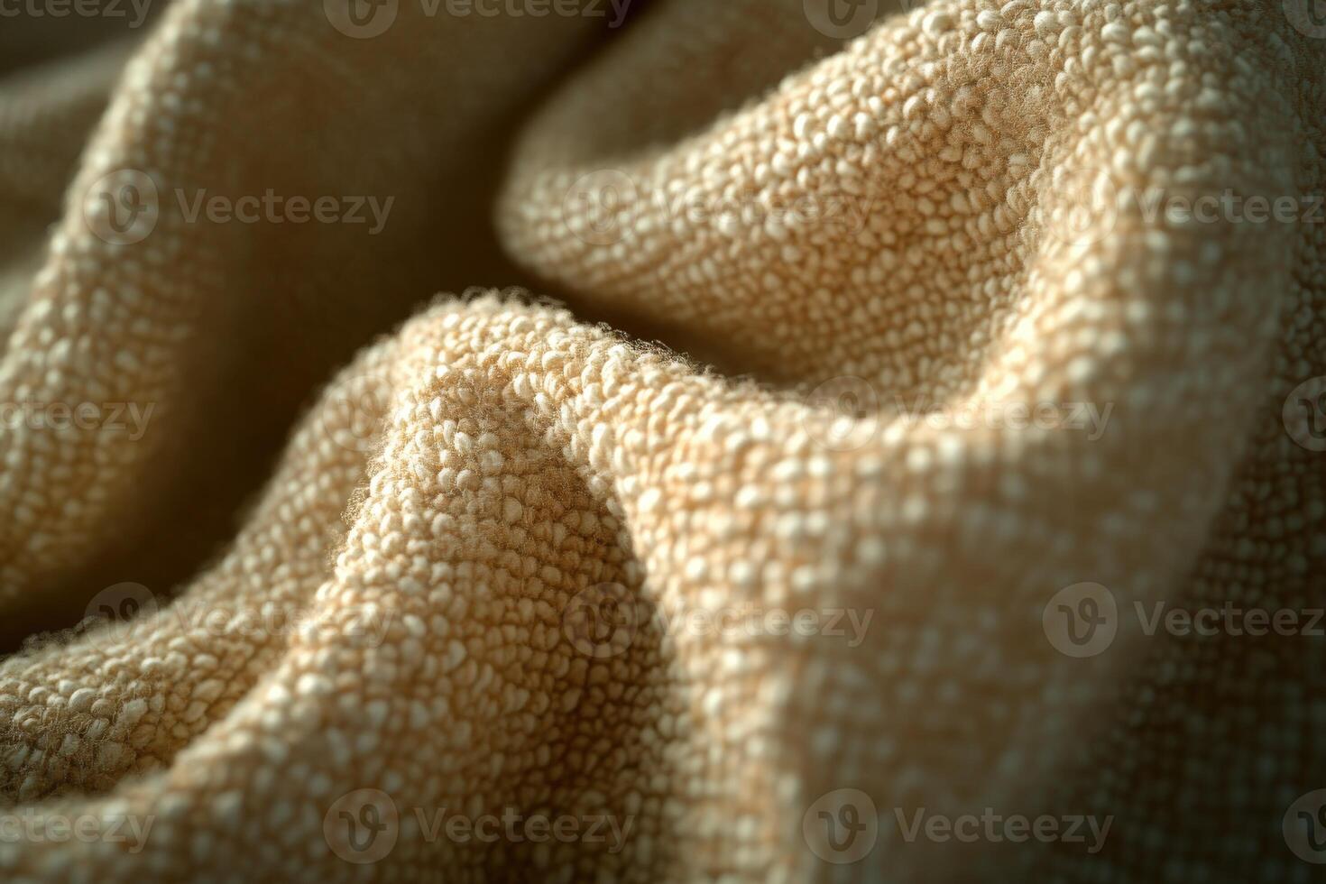 Boucle fabric close-up showcasing intricate texture and warm shades in natural light photo