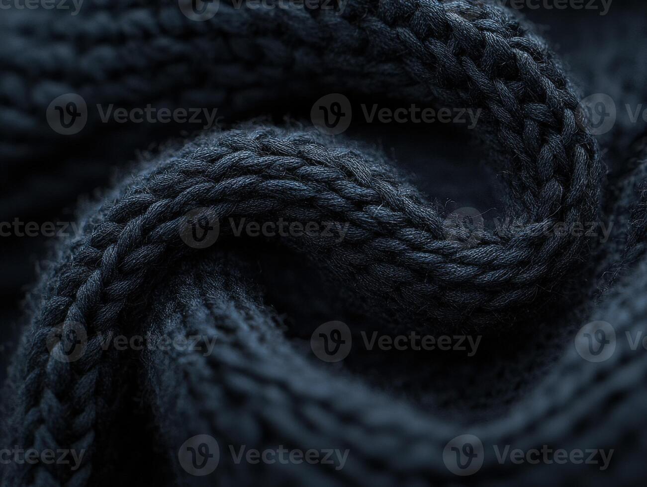 Soft texture of dark boucle fabric showcasing intricate weaving patterns in close-up detail photo