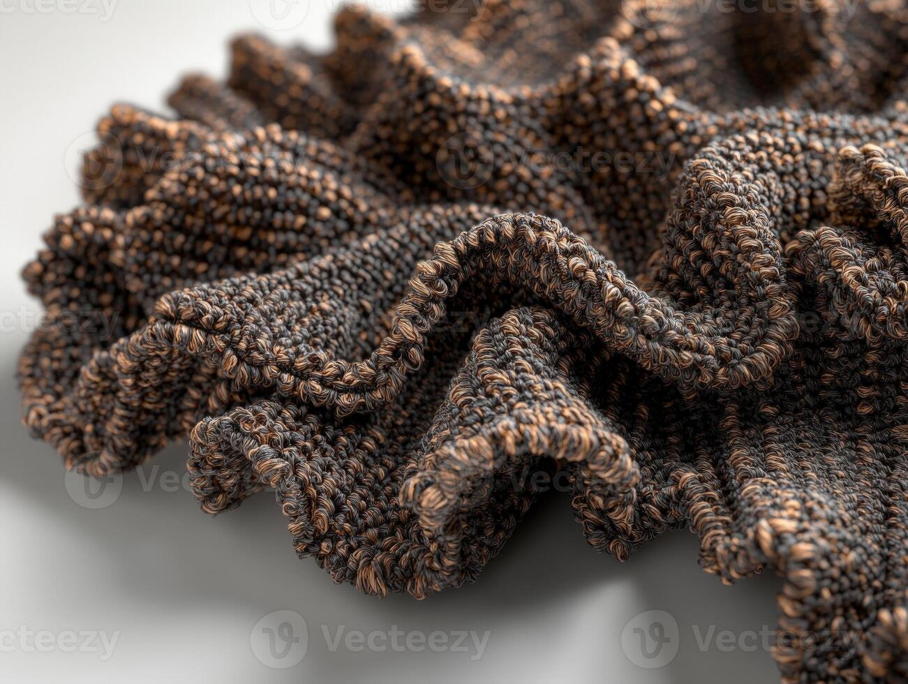 Intricate details of boucle fabric showcasing its textured elegance and unique ruffled design in soft brown tones photo