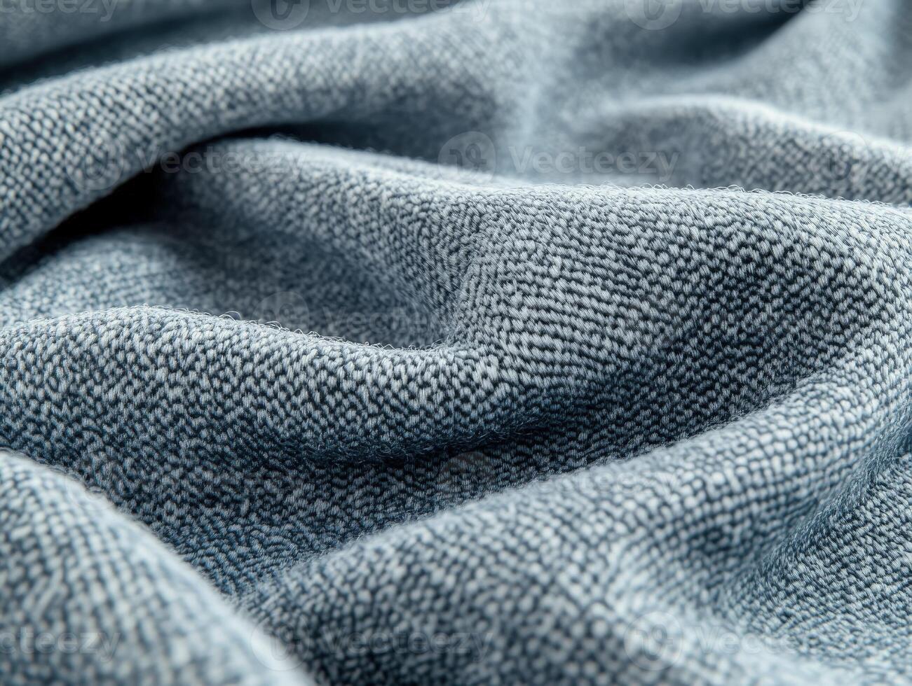 Explore the unique texture of boucle fabric captured in intricate folds and waves, showcasing its soft and inviting nature photo