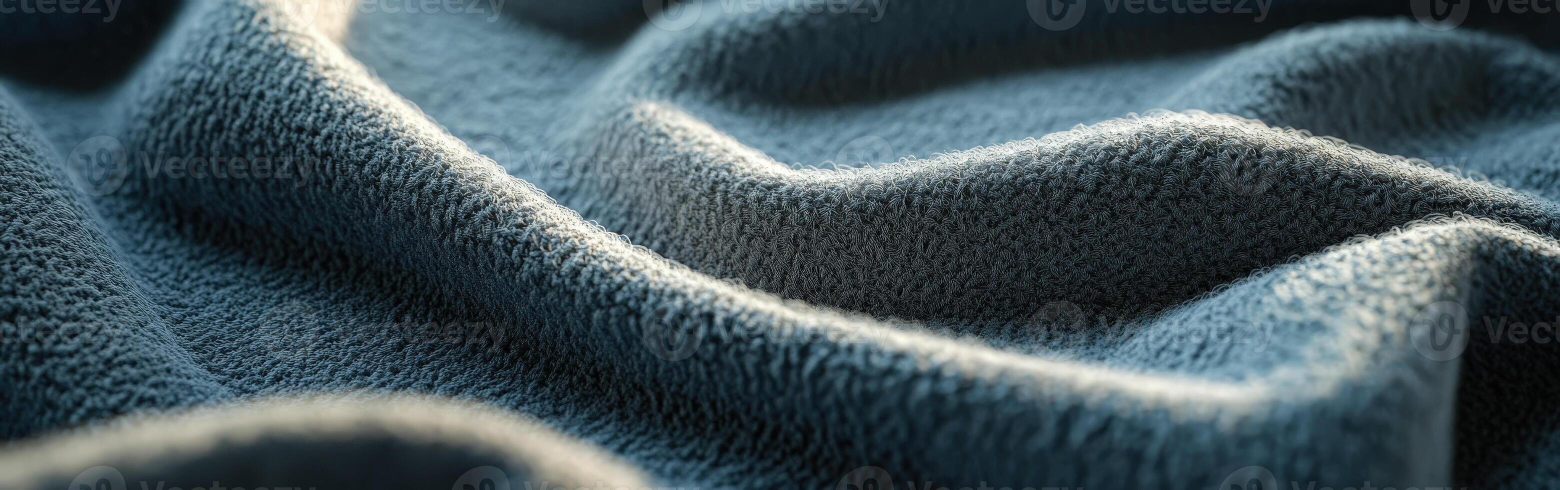 Soft boucle fabric texture draped on a table, showcasing intricate details and gentle waves of material in natural light photo