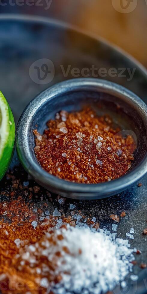 Delicious Tajin seasoning served with lime for enhancing flavors of fruits and snacks photo