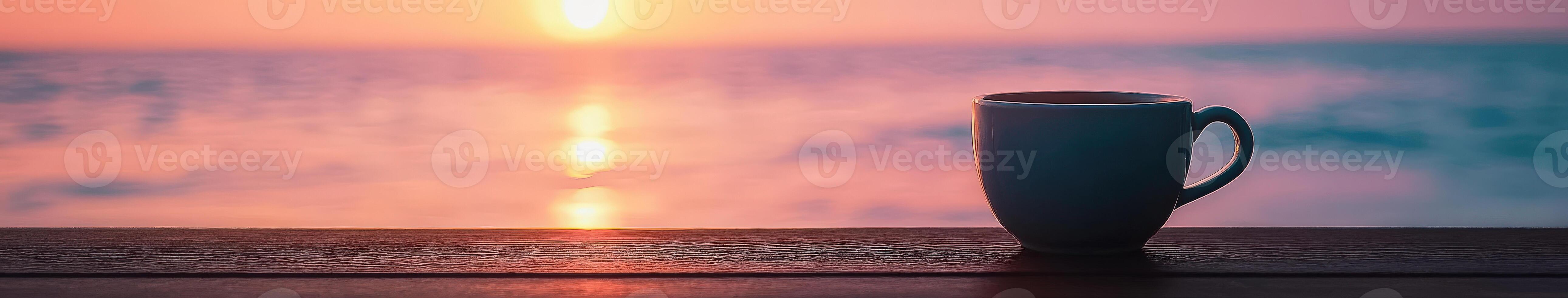Enjoying coffee at sunrise by the ocean shore photo