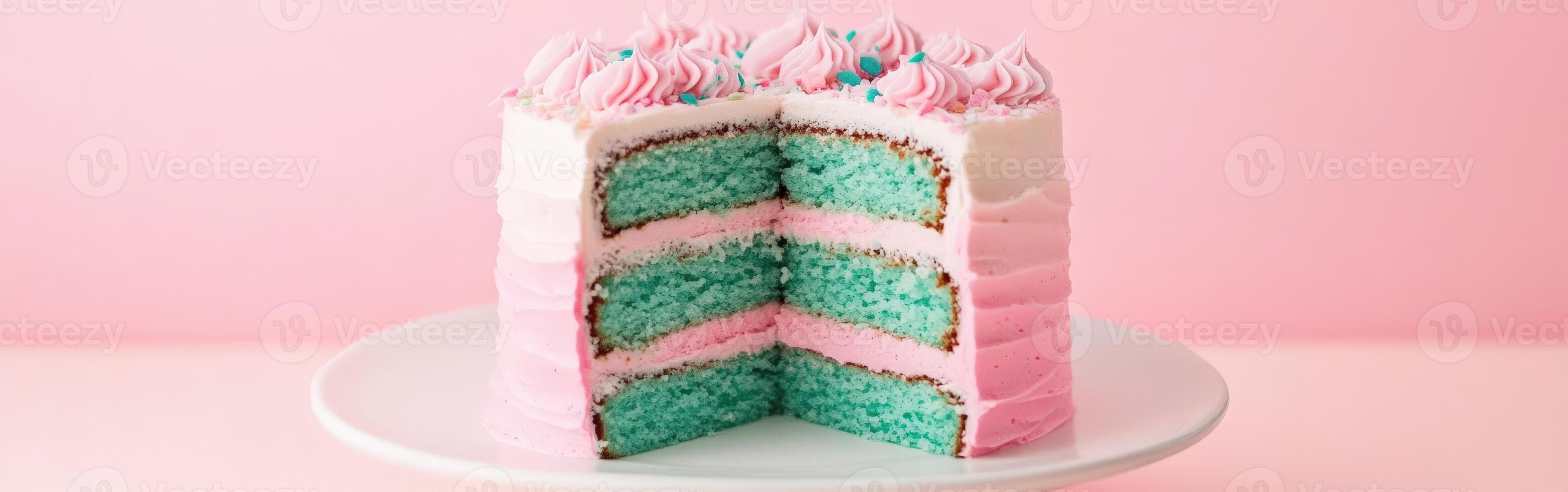A slice of cake with pink and blue frosting photo