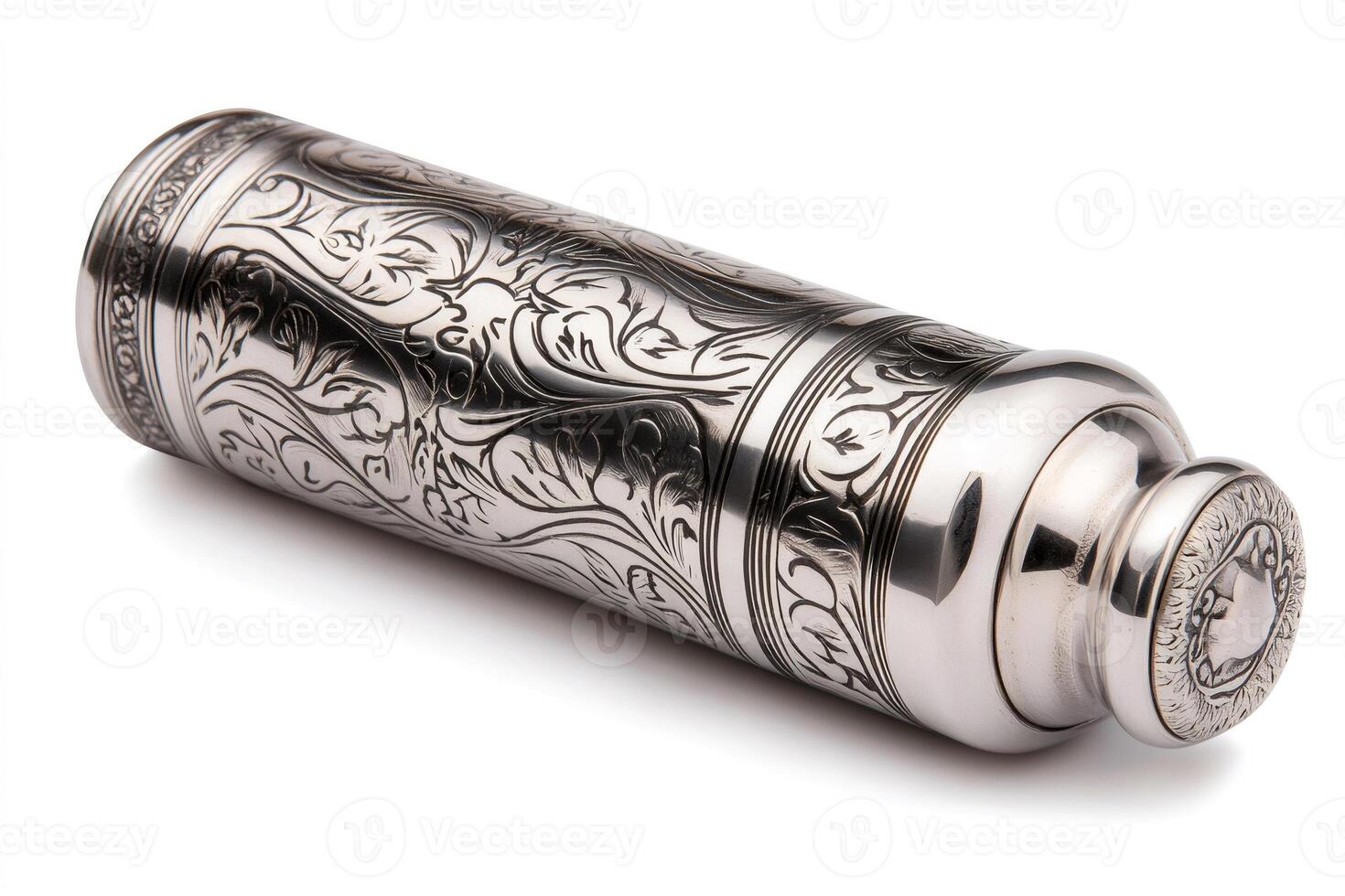 Elegant metallic container lying on white background with floral engravings photo