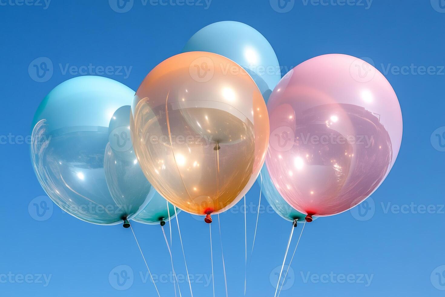 Colorful balloons floating in the blue sky are bringing joy and celebration photo