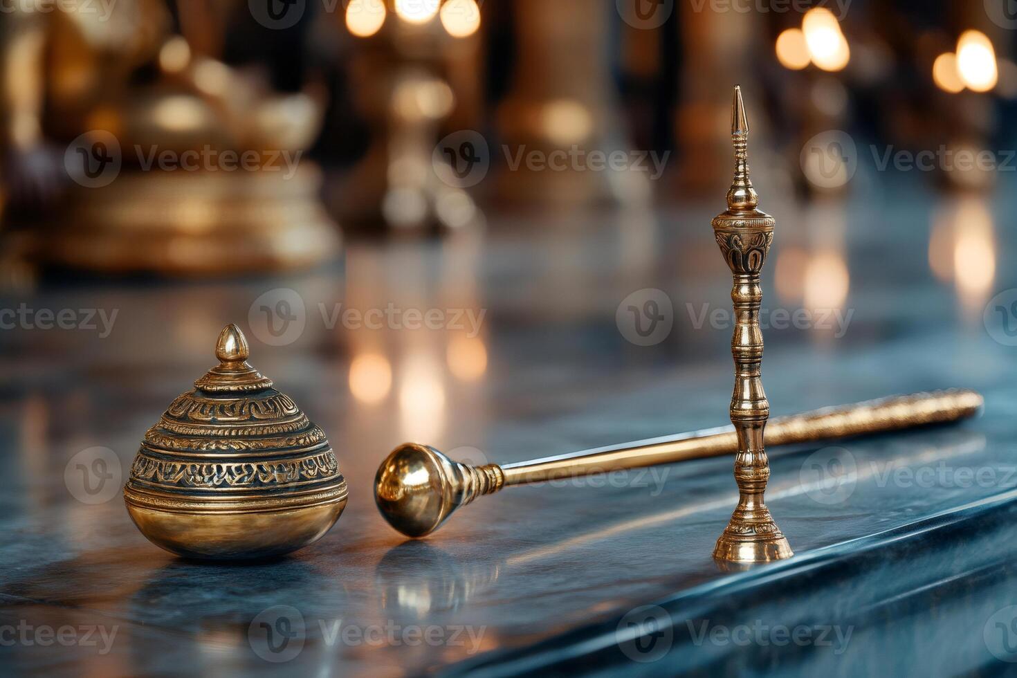 Buddhist ritual objects shining in candlelight in temple photo