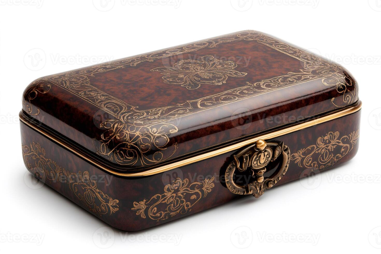 Closed decorated wooden box with golden floral patterns and metal handle is lying on white background photo