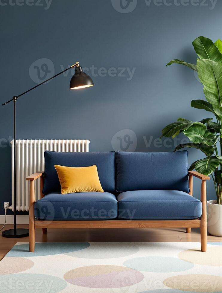 A blue sofa and a lamp in front of a wall photo