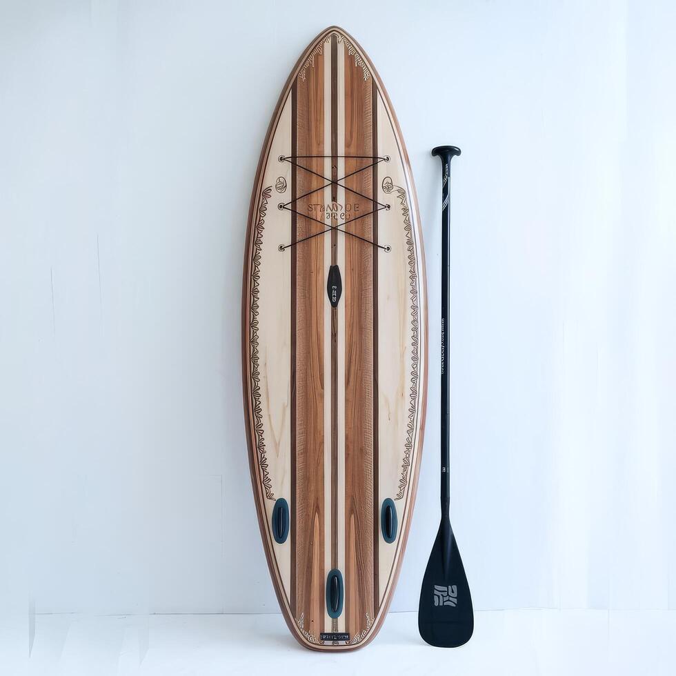 A paddle board and paddle with a wooden stand up paddle board photo