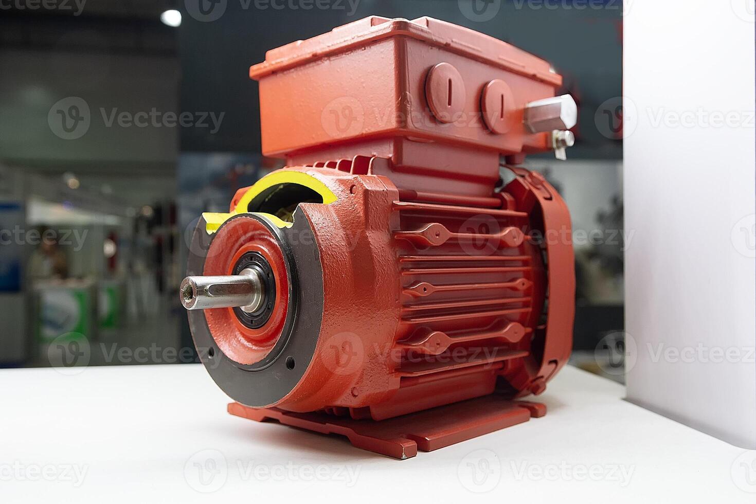 New red electric motor on the exhibition stand. Industry photo