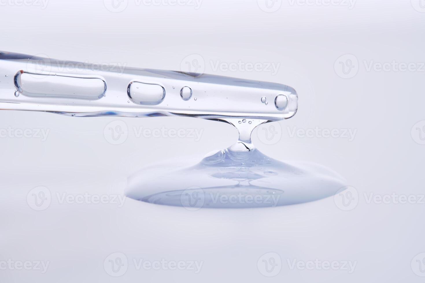 Pipette with delicate blue serum close-up. photo