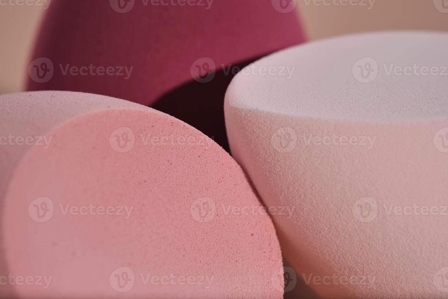 The texture of makeup sponges on a pink background. photo