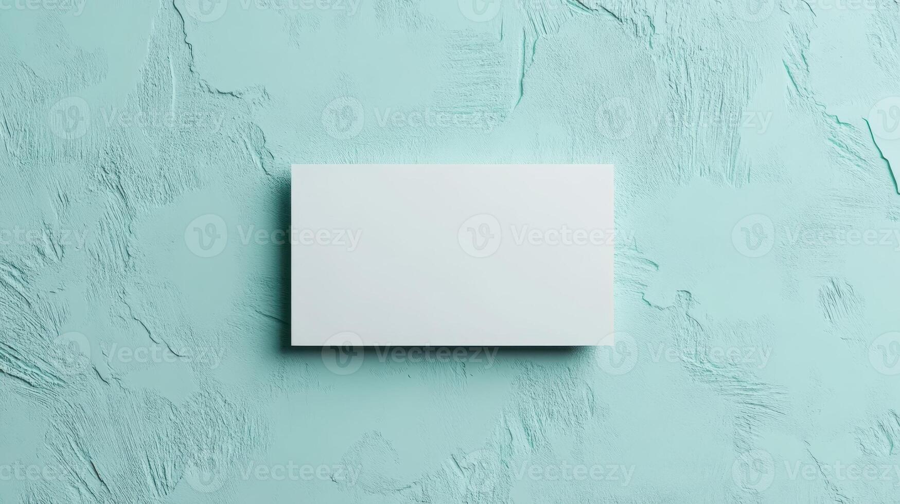 Top view template for business card. Mockup white card on texture background in mint pastel color. photo